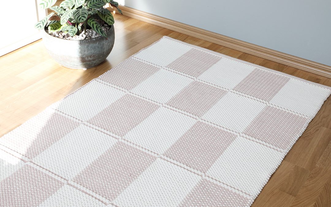 A checkered cotton rug